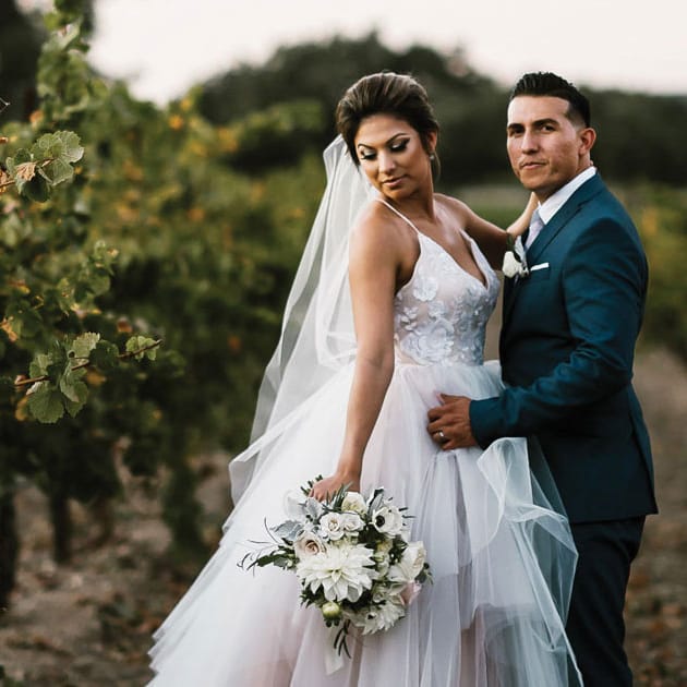 Soft pastels and a perfect wedding gown set the stage for a dreamy vineyard wedding