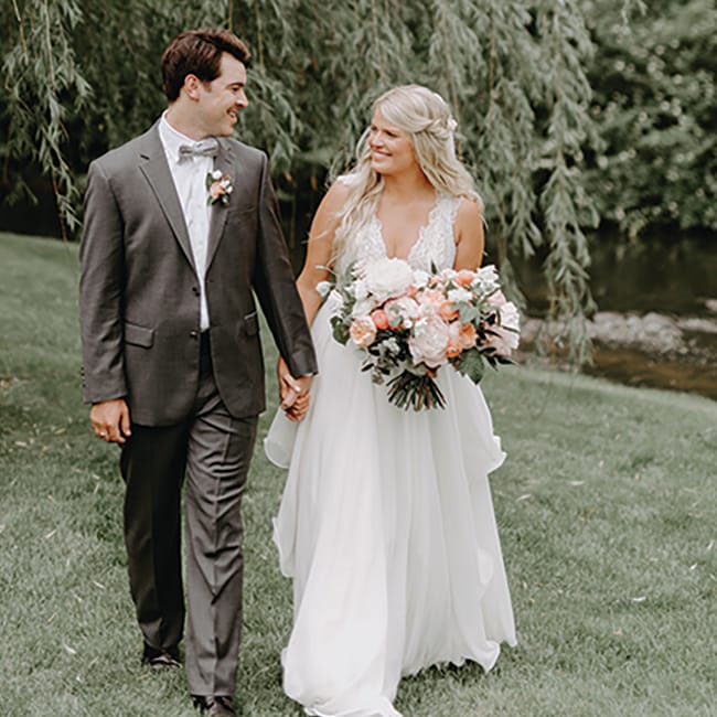 Kate and Lucas walk the grounds at Creekside Farm Weddings & Events