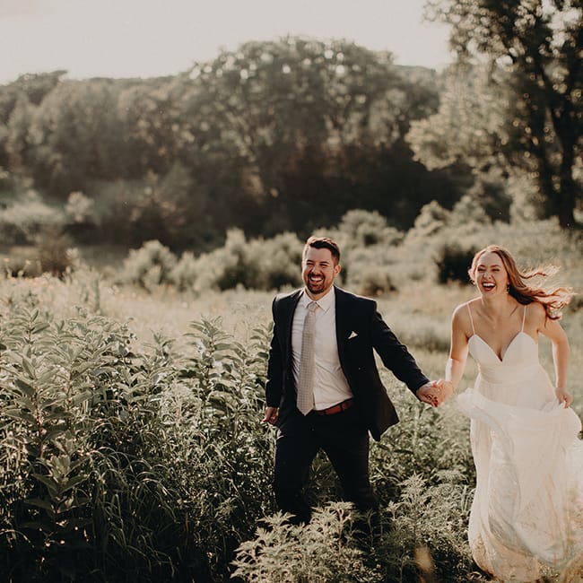 Heidi and Erik walk the grounds at Almquist Farm, a wedding venue in Hastings.