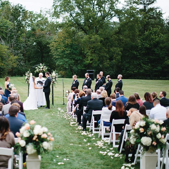 Cara Rosch and Alex Biholar during their wedding ceremony at Yerkes Observatory.