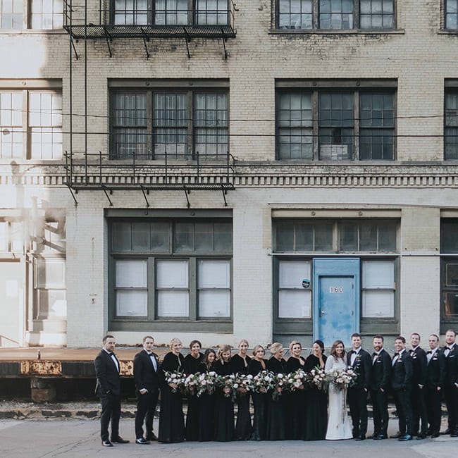 Danielle Kapitz and Michael Maletzke and their wedding party at the Black Swan Riverwalk, a Milwaukee wedding venue.