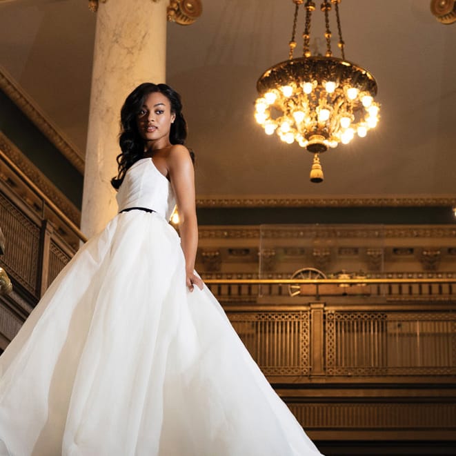 Model poses in trendy wedding gown at The Society