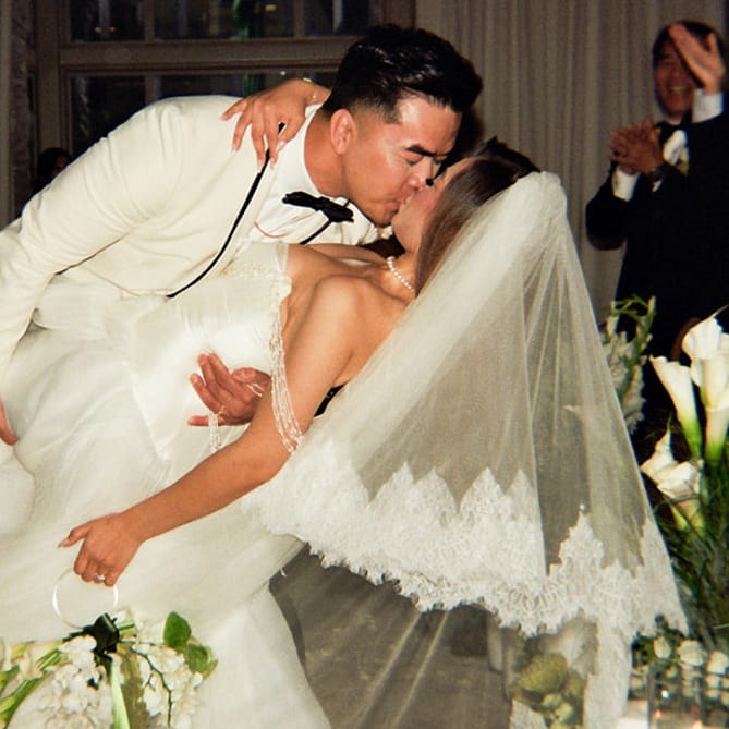 Helen and Tung kiss in the middle of the opulent aisle in their wedding day at Fairmont Olympic
