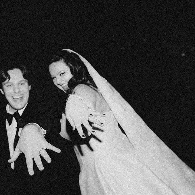 Lauren and Drew pose showing off their rings at Le Veneré