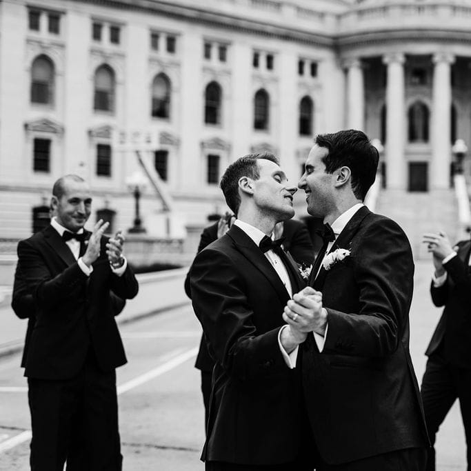 Zach and Clay Celebrating with their Wedding Party in Madison, Wisconsin