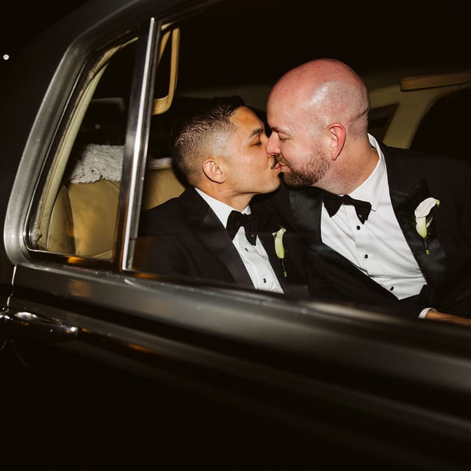 Kendall and Kyle kiss in their vintage getaway car on their wedding day