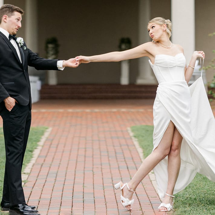 Layne and Nick pose in their wedding attire on the grounds of  Villa Bellezza
