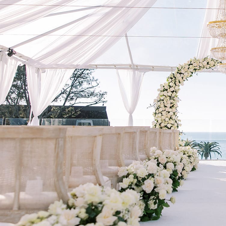 Monochromatic ivory ceremony scene at L'Auberge Del Mar