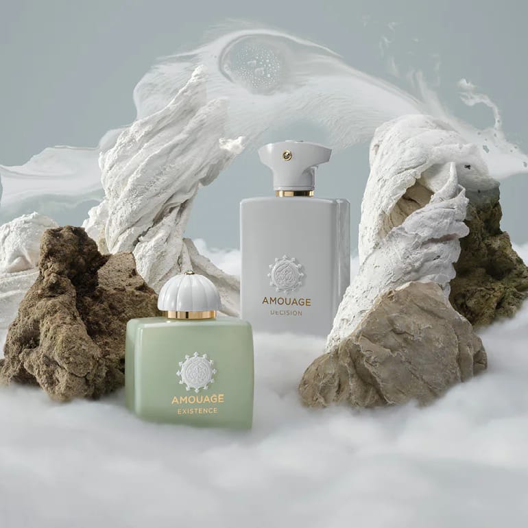Amouage perfume promotional photo, fragrance bottle in center surrounded by clouds