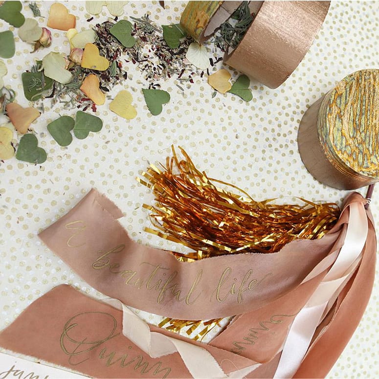 Ribbon wants, natural confetti and metallic streamers all make for great wedding exit options