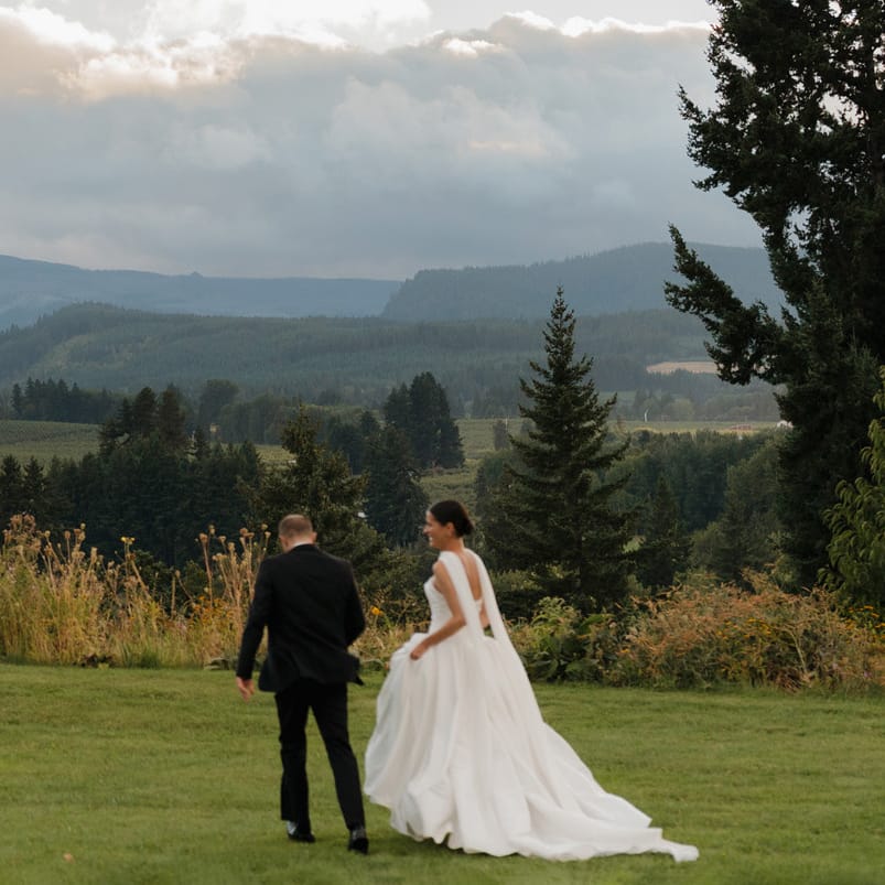 Maya and Scott walk the grounds of Mt Hood Organic Farms on their wedding day