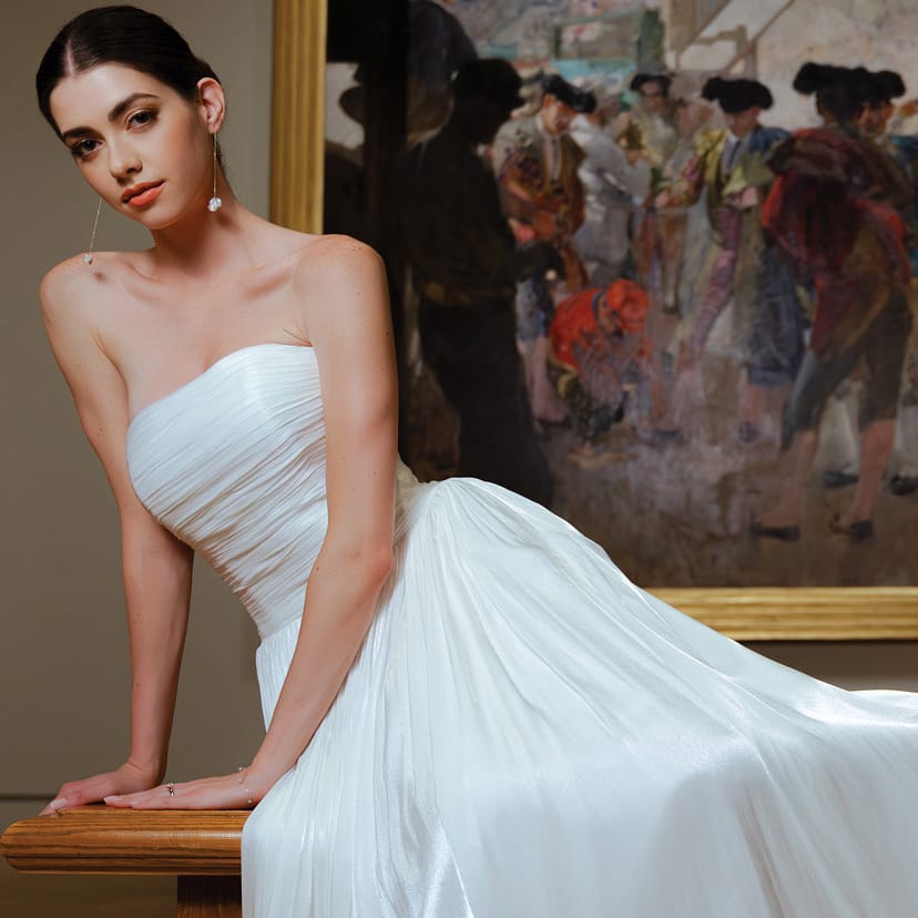 Model poses in bridal gown amidst artwork at Minneapolis Institute of Art