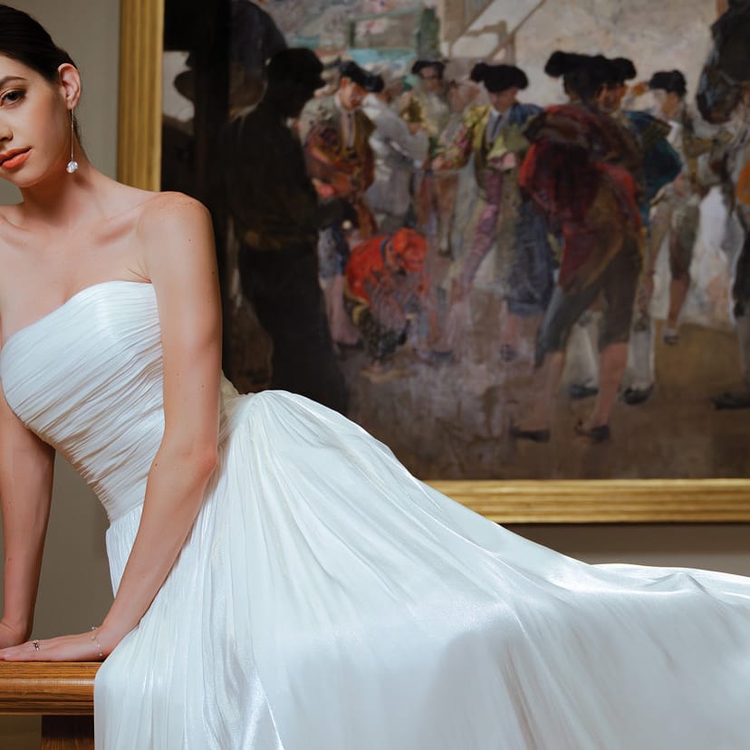 Model poses in bridal gown amidst artwork at Minneapolis Institute of Art