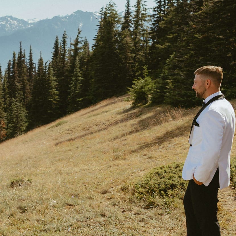 Laney spins for Troy in her bridal attire, set against the scenic views of the Olympic Mountains