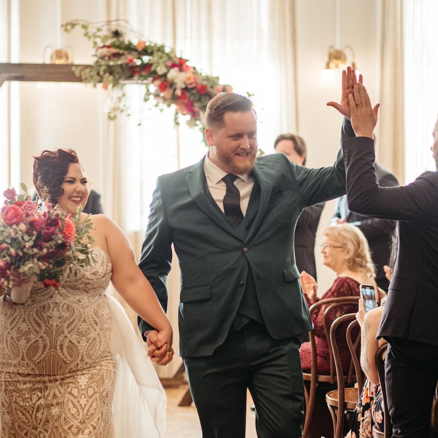 Molly and Kevin Smile as they Walk Down the Aisle after Exchanging Vows at Holbrooke Hotel