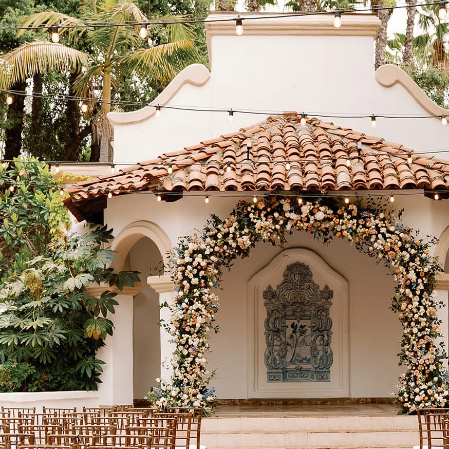 Ceremony space marked by soft florals at Rancho Las Lomas